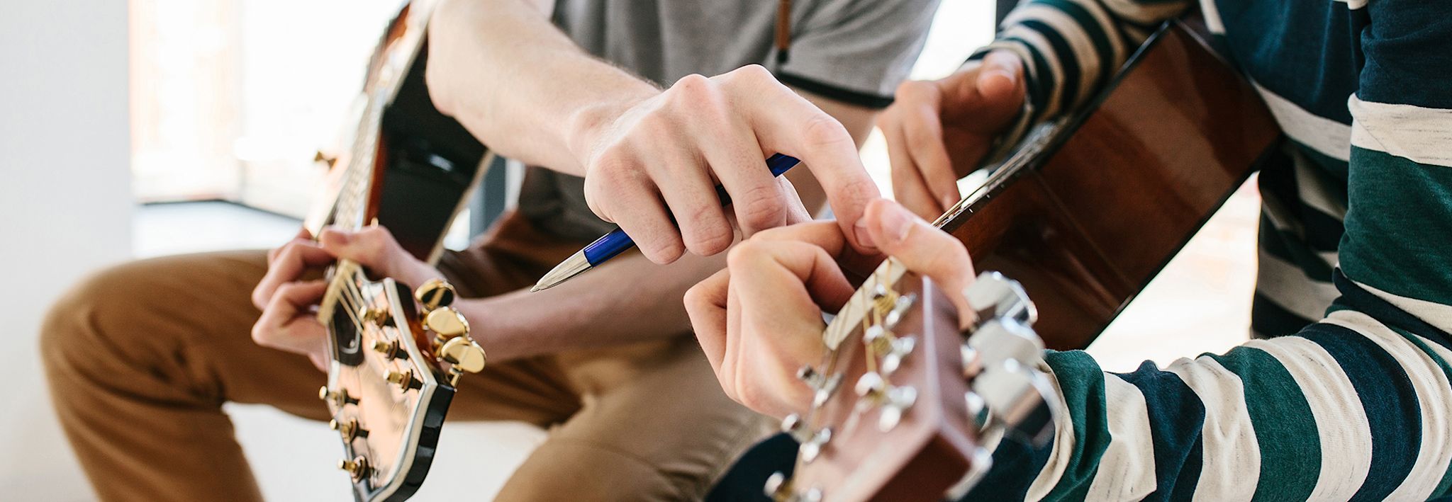 Colorado Christian University student getting guitar lessons. 