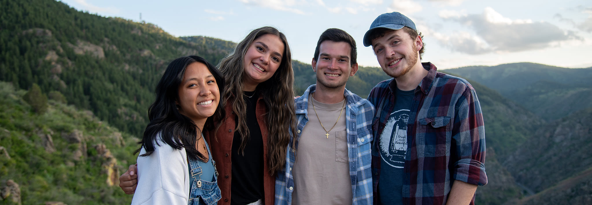 cus students on a hike smiling together