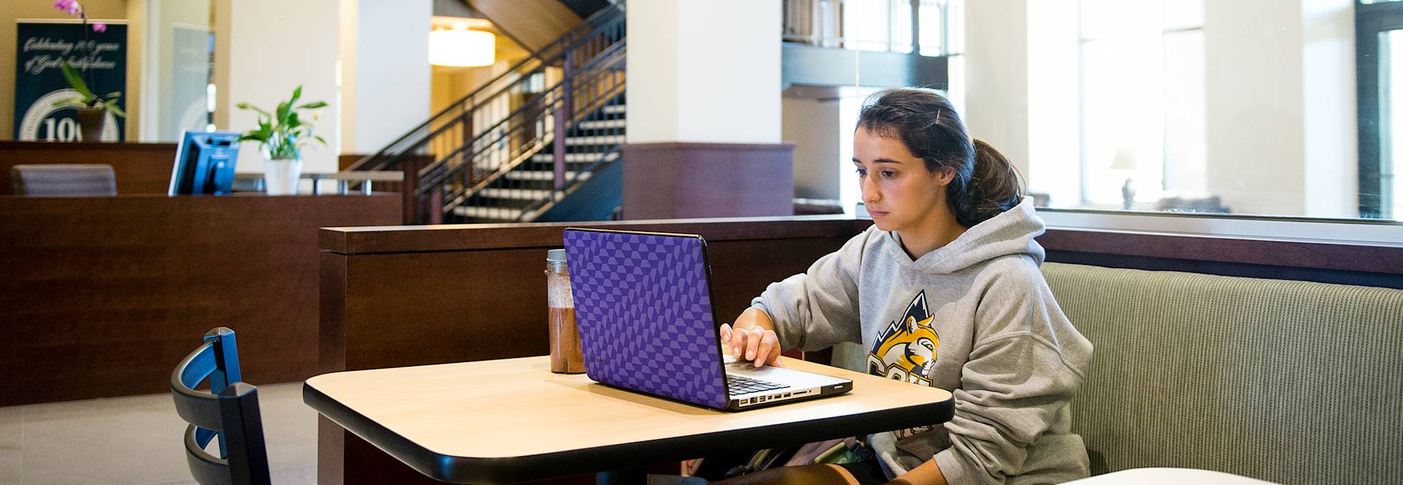 CCU student studying in Food for Thought. 