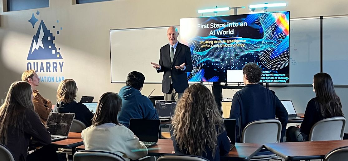 Dr. Kotter teaches a class about 'First Steps into an AI World' from a classroom inside the Quarry Innovation Lab.