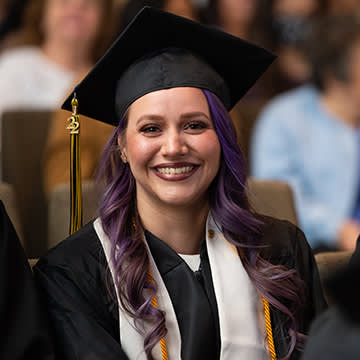 Adult female student at commencement ceremony