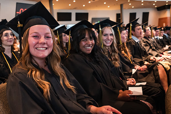 smiling cus graduates