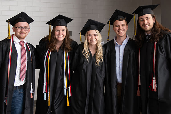 smiling cus graduates