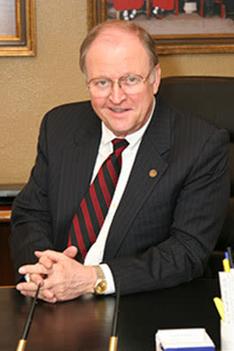 bill armstrong smiling at his desk