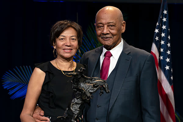 doctor woodson and wife with the armstrong award