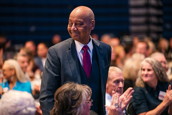 doctor woodson walking to accept award