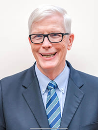 hugh hewitt smiling wearing a dress suit