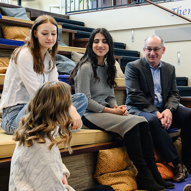 students talking with centennial institute director