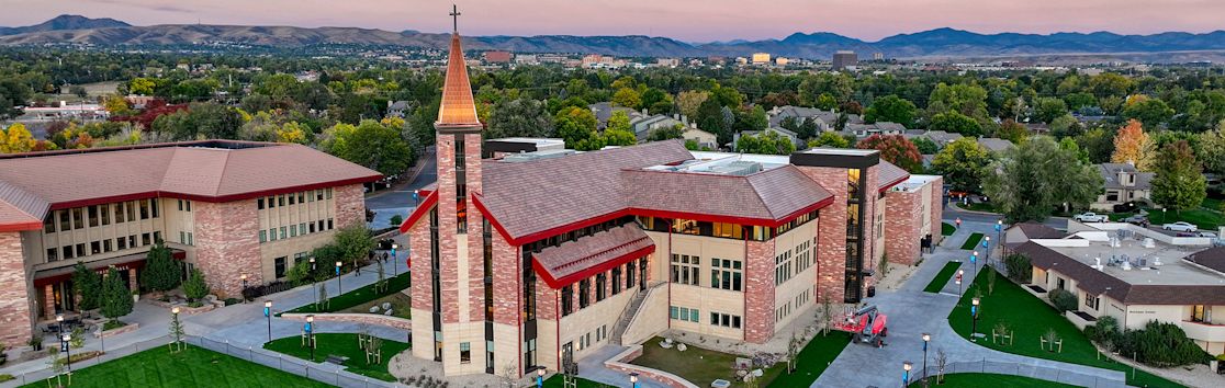 ccu students outside on campus smiling at the camera (slide 1 of 5)