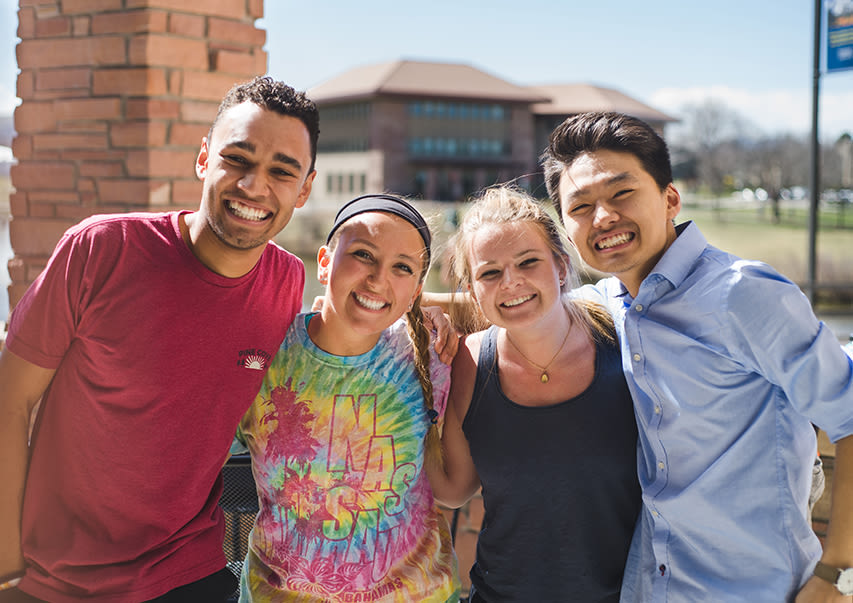 Four students visiting CCU's campus