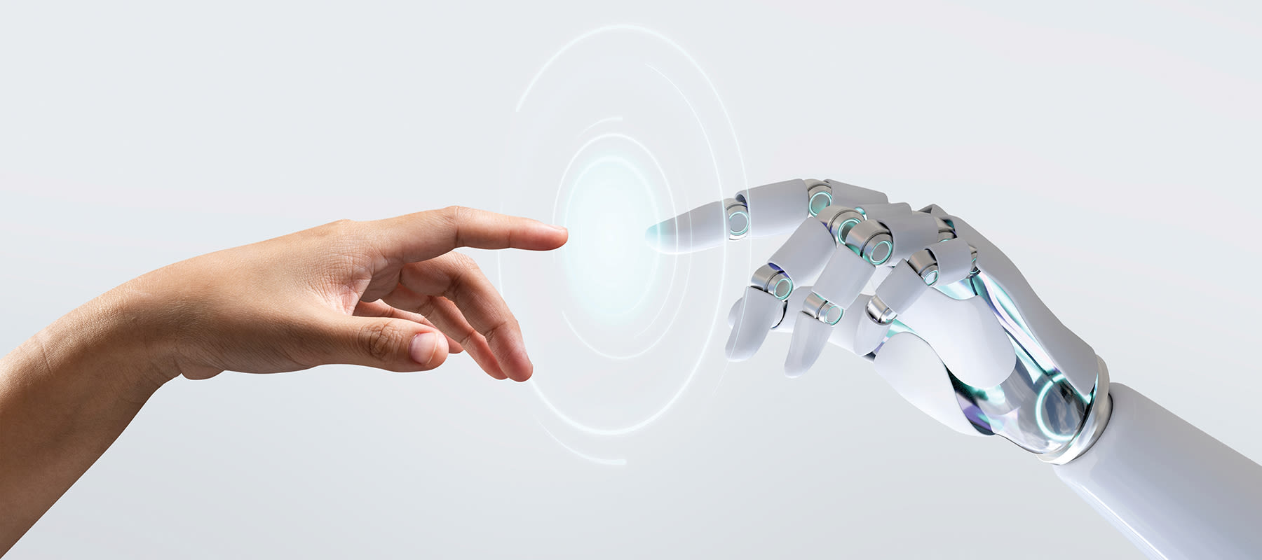 human hand touching a robot hand