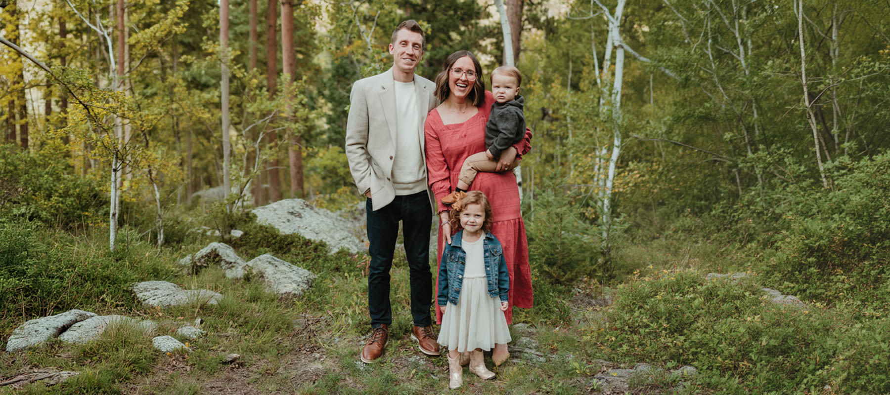 Nate and Brenna Grasz pose with their two children for a family photo