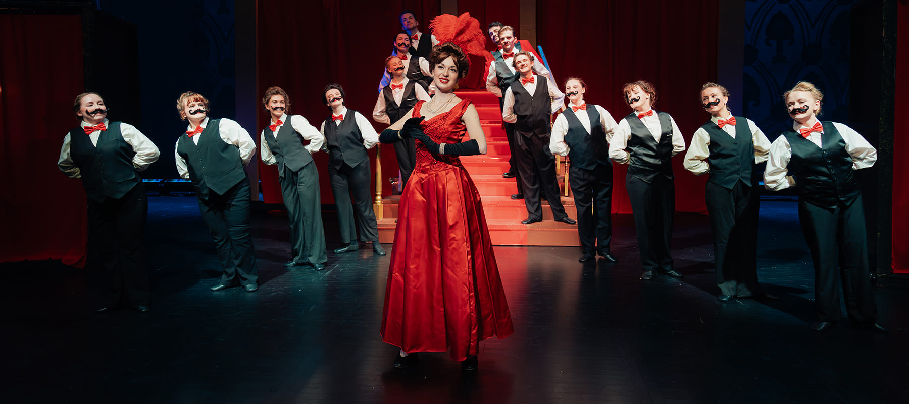 The cast of Hello, Dolly! poses for a photo during dress rehearsal