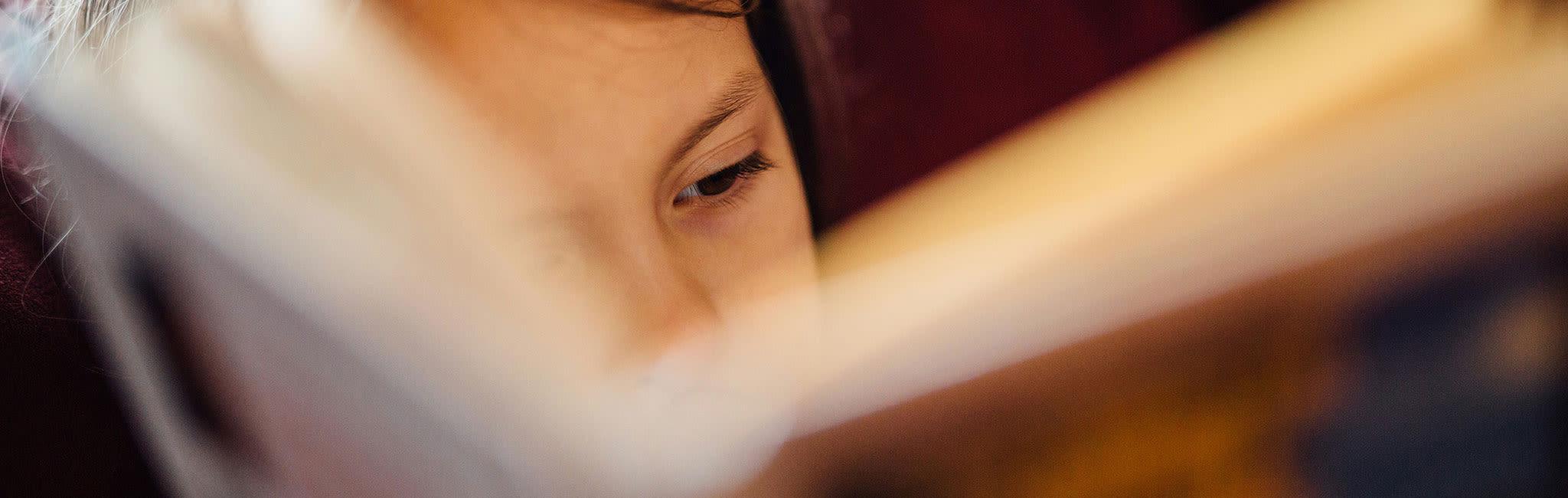 young girl reading a book