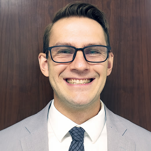 Circular headshot image of Paul Grizzle