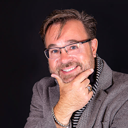 Circular headshot image of Charles Denler