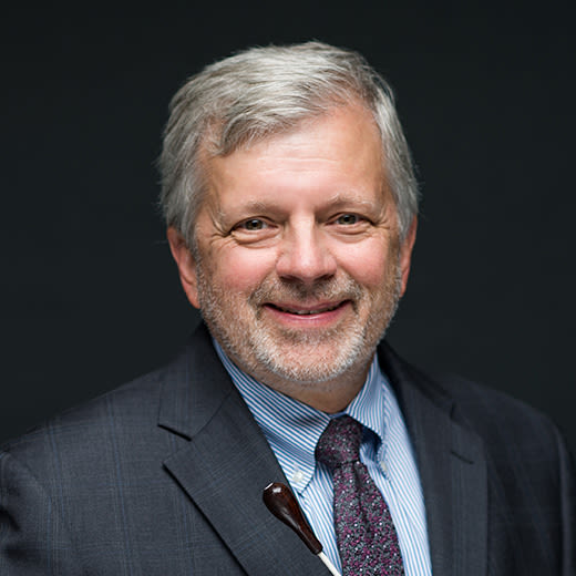 Circular headshot image of Mark Dorn