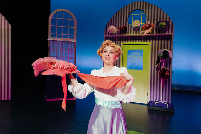 A cast member of Hello, Dolly! acts in a scene of the production