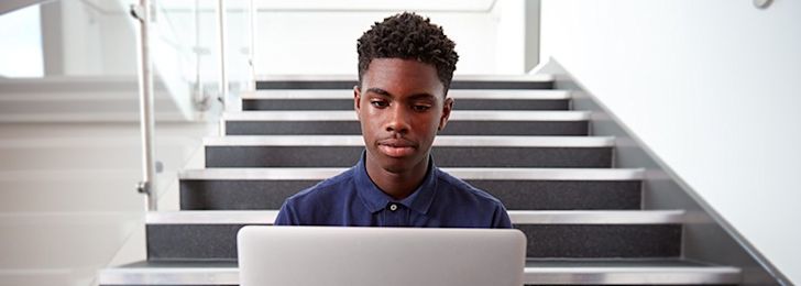 Potential Academy student, working at a desk.