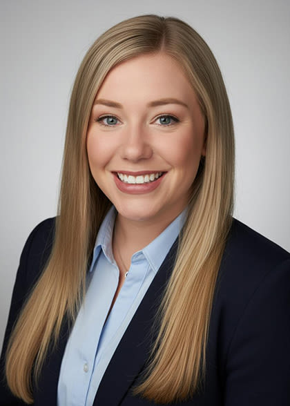 Kerrie Baiz bridget radke smiling with a gray background