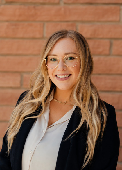 bridget radke smiling with a gray background