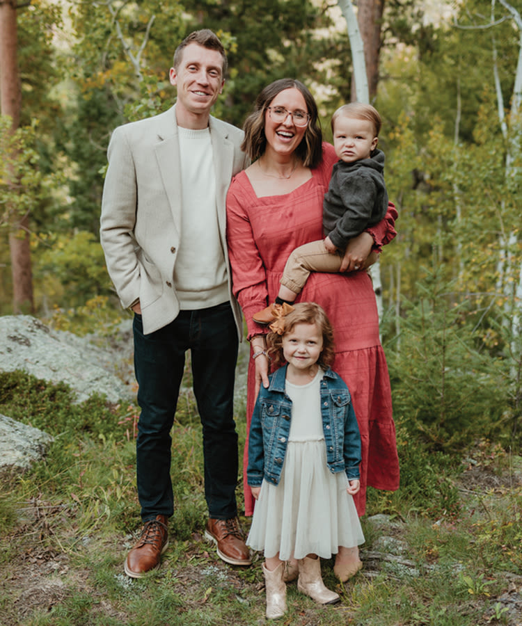 Nate and Brenna Grasz pose with their two children for a family photo