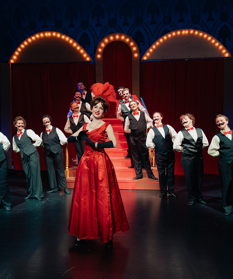 The cast of Hello, Dolly! poses for a photo during dress rehearsal