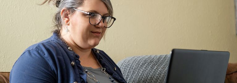 a woman on her computer doing homework