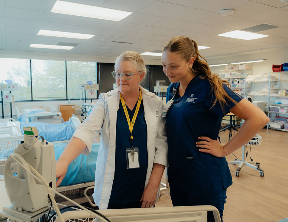 nursing faculty with student at ccu