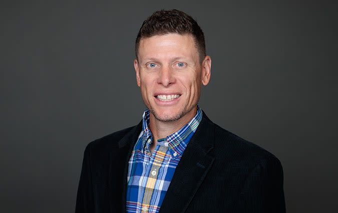 Headshot photo of Dr. Travis Buchanan