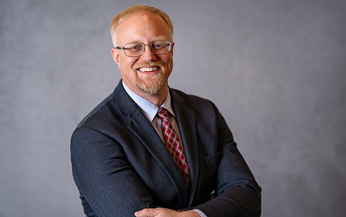 Headshot photo of Dr. John Wind