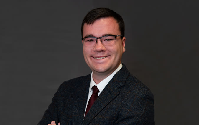 Headshot photo of Joshua Cook