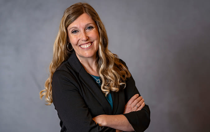 Headshot photo of Naomi Woo