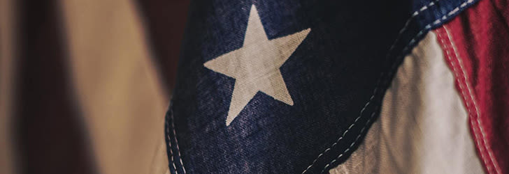 Close-up of a red, white, and blue flag with a single large, white star.