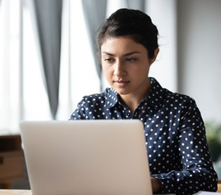 girl with laptop studying online