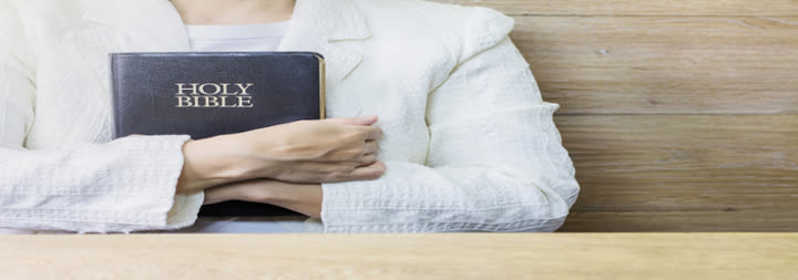 woman holding a bible