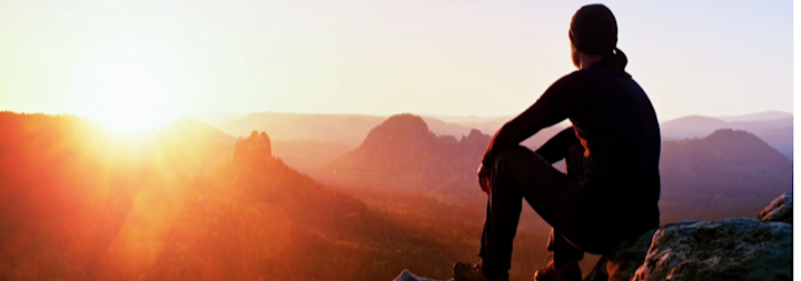 Male looking out at mountain