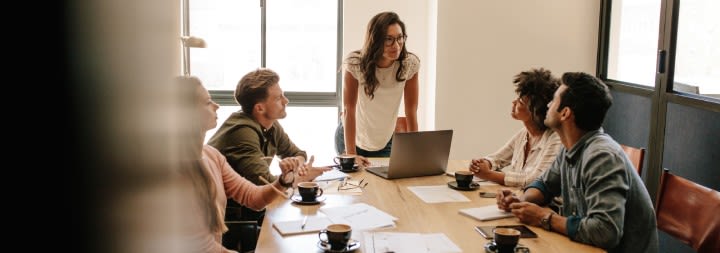 ethical business men and women sitting at a table