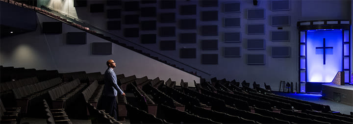 pastor standing in an empty church