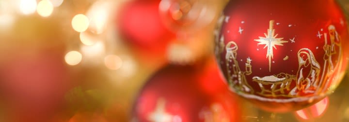 red and gold Christmas ornaments on a tree