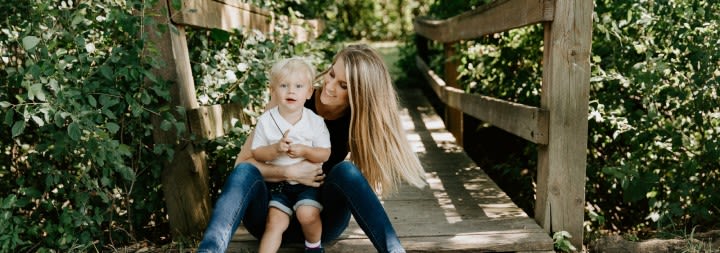 smiling mom with son outside