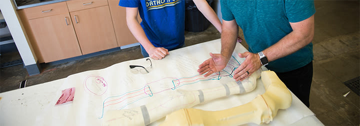 man and woman modling a prosthetic leg