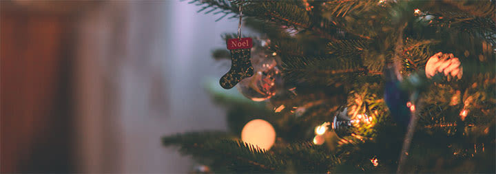 sparkling christmas tree with ornaments and white lights