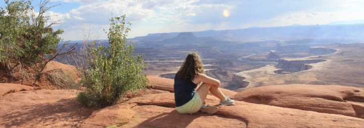 female overlooking canyon