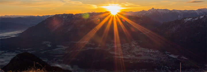 beautiful mountain range with shining rays of sun
