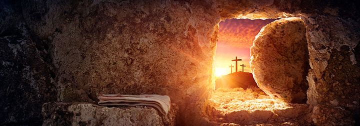 View out of tomb at stone moved and three crosses at sunset