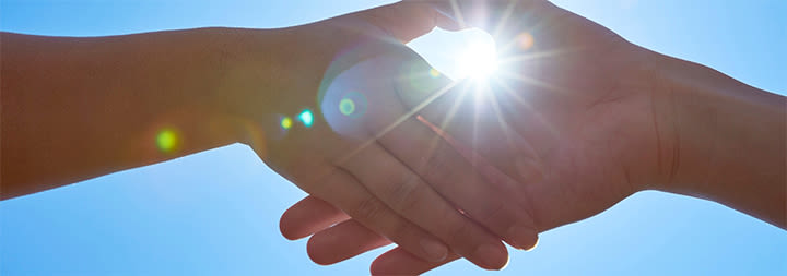 shaking hands in the sun