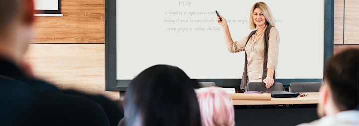 female teacher at whiteboard