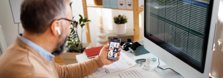 male ccu student working at a desk and computer