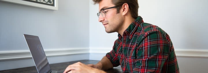 ccu student working on a laptop